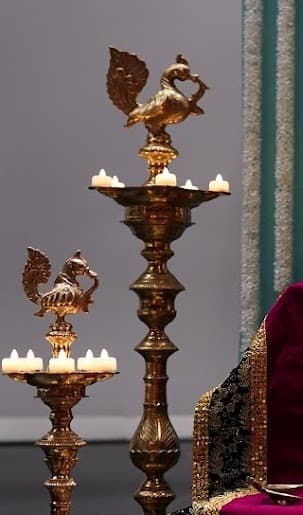 Detail of brass peacock lamps